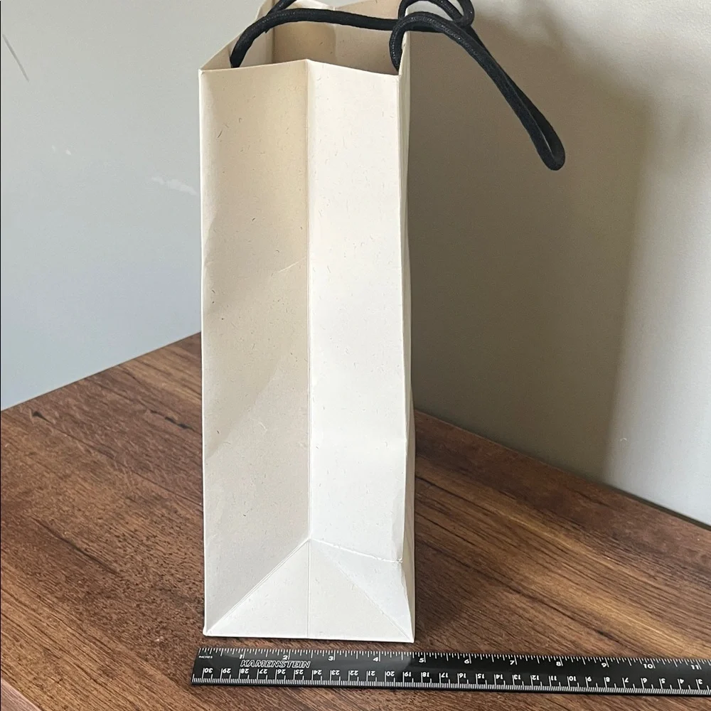 Loewe Cream Paper Gift Bag with Black Logo and Yellow Tag